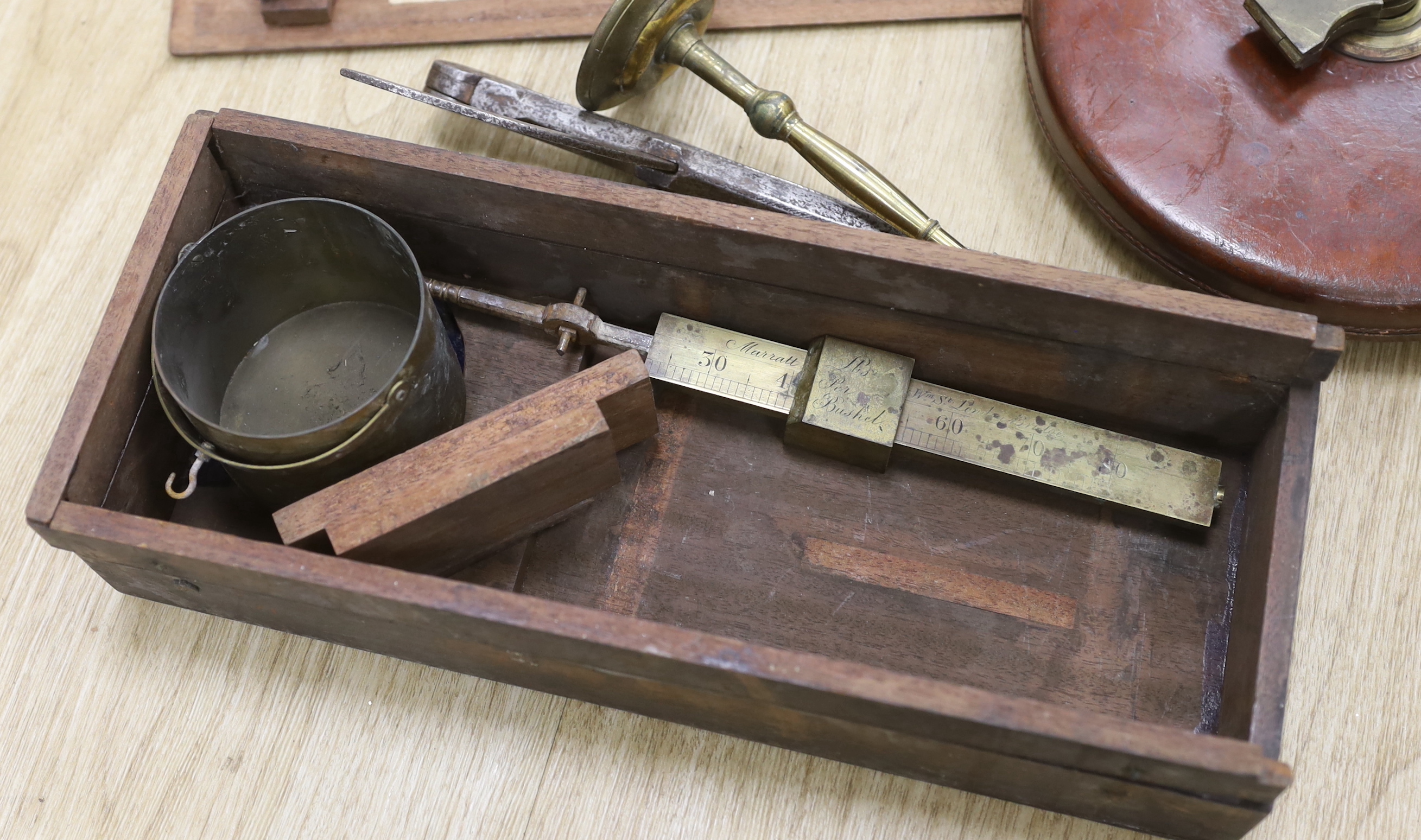 A late Georgian Marratt & Short Improved Chondrometer, a large surveyor's measure and a cast iron protractor